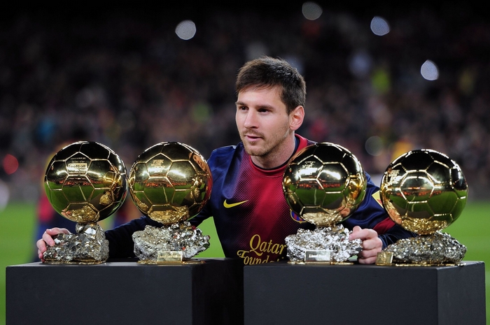 Lionel Messi with four Ballon d'Or awards