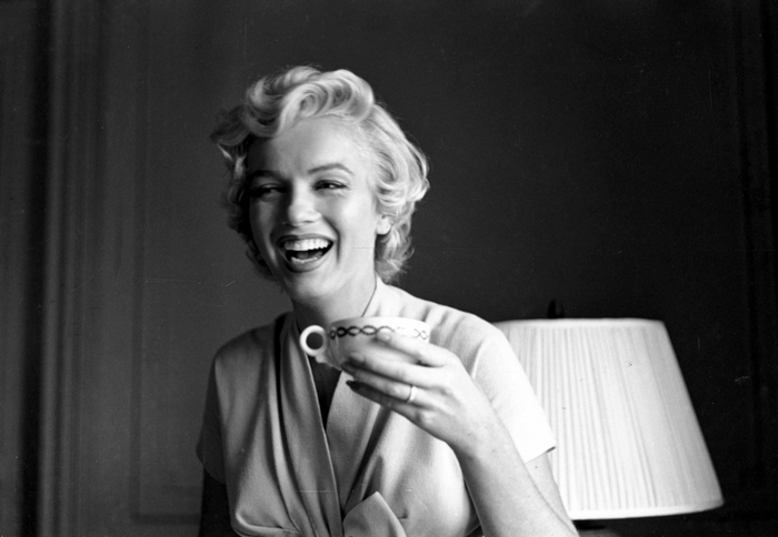 Marilyn Monroe holding a teacup