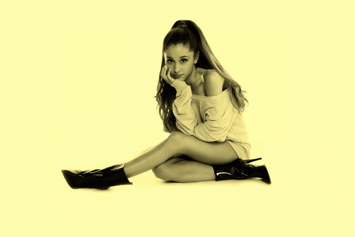 Ariana Grande sitting on the floor