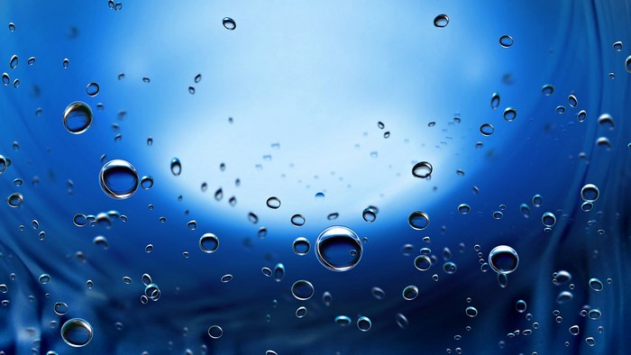 Water droplets on a blue background