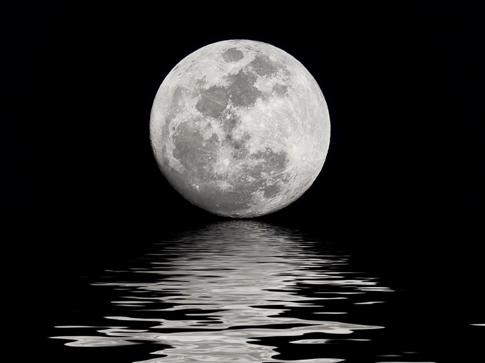Full moon reflected in water