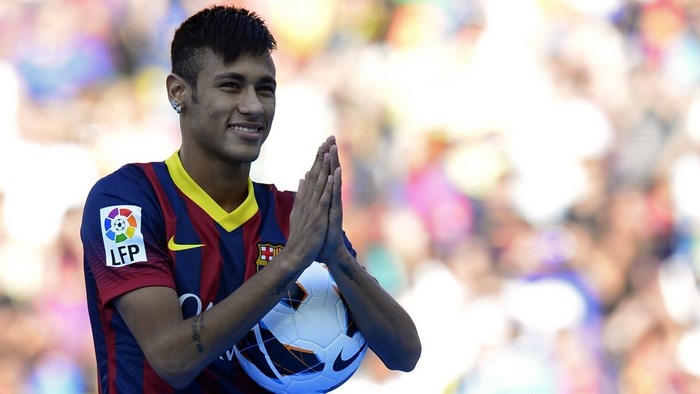 Neymar Jr. holding a soccer ball