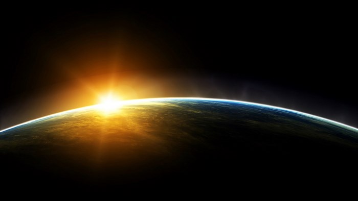 Sunrise over planet Earth from space