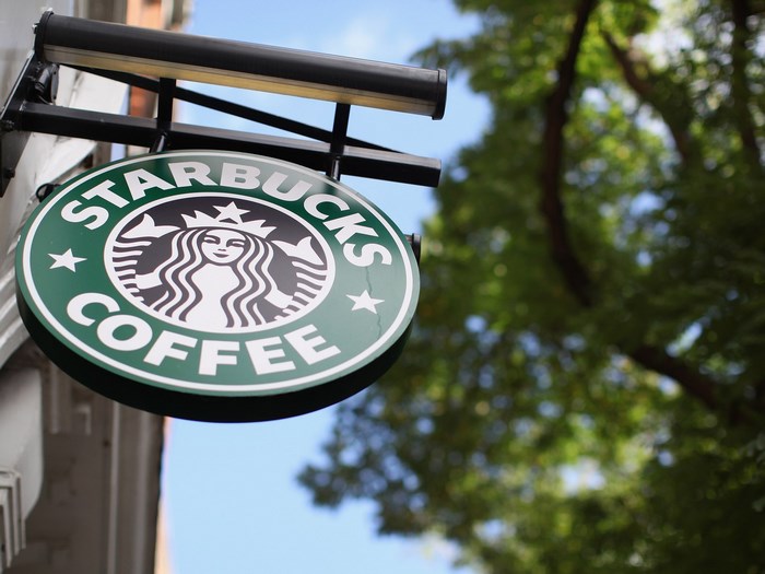 Starbucks Coffee sign hanging outside
