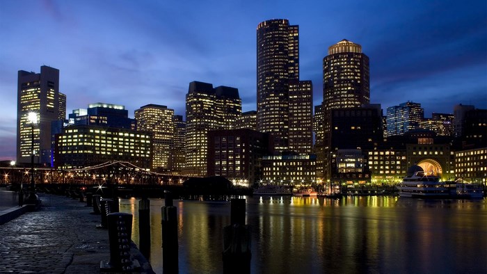 Boston skyline at night with harbor