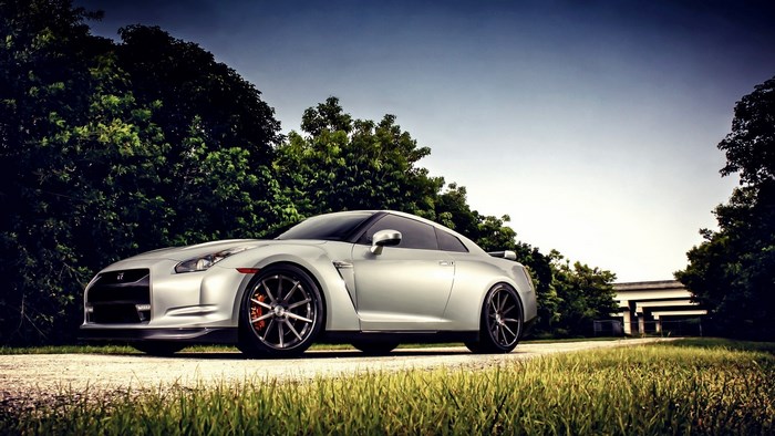 Silver Nissan GT-R parked on a dirt road