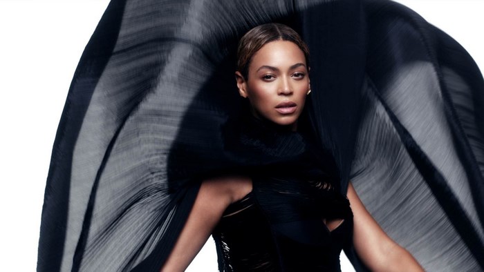 Beyoncé in black dress with flowing fabric