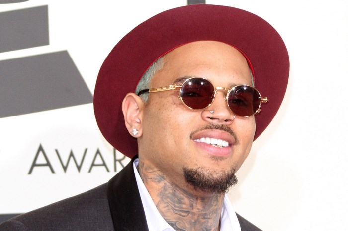 Chris Brown wearing a hat and sunglasses