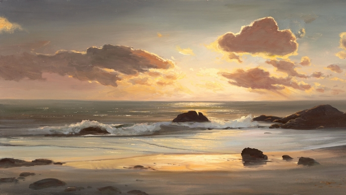 Sunset over the ocean with waves and rocks