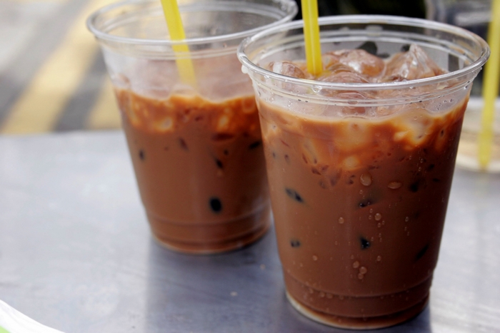 Two iced coffee drinks with straws