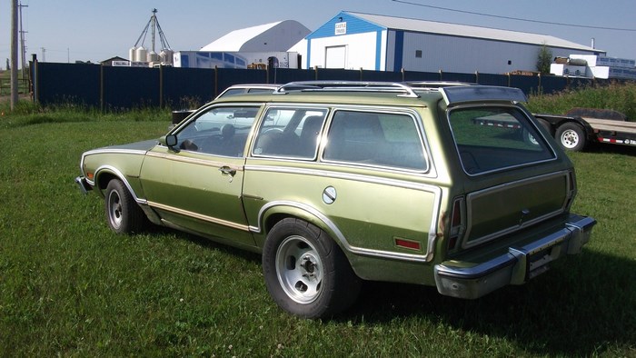 Green Ford Pinto Wagon parked on grass