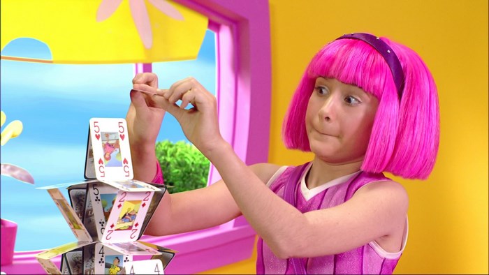 Stephanie from LazyTown building a house of cards