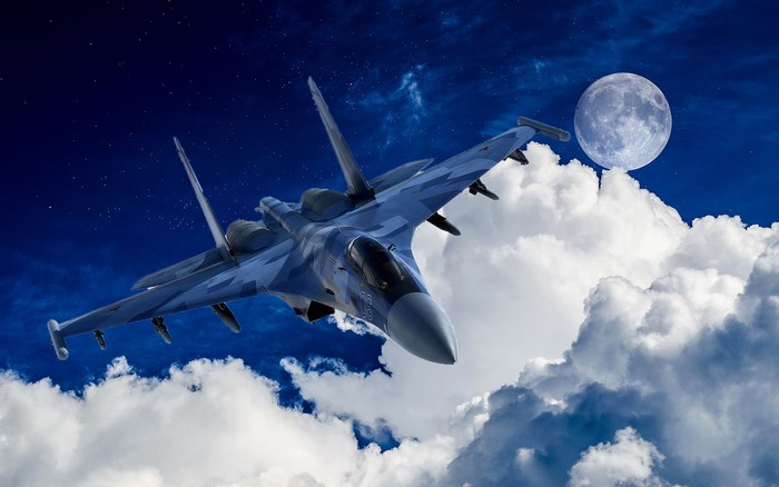 Sukhoi Su-35 fighter jet flying at night