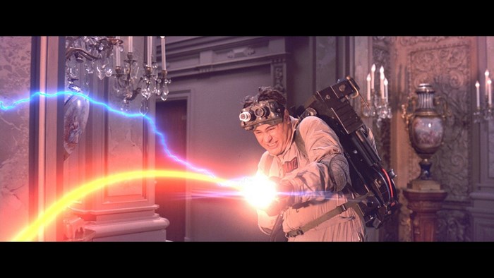 Ghostbusters character firing proton pack in ornate room