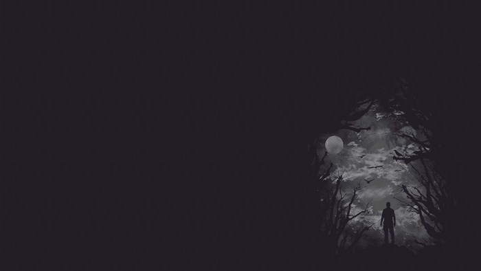 Man standing in a dark forest under the moon