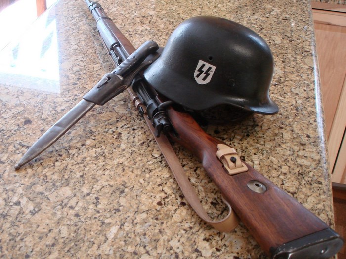 K98 Mauser rifle with bayonet and SS helmet