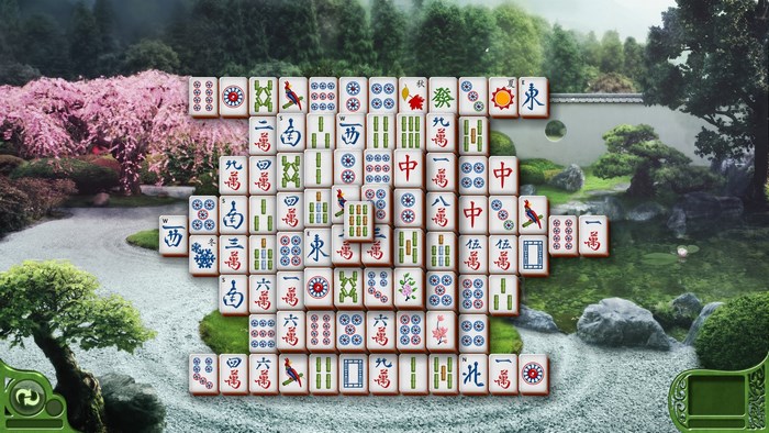 Mahjong tiles arranged in a Japanese garden setting