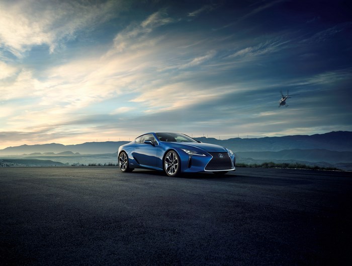 Blue Lexus LC 500 with Helicopter and Mountains