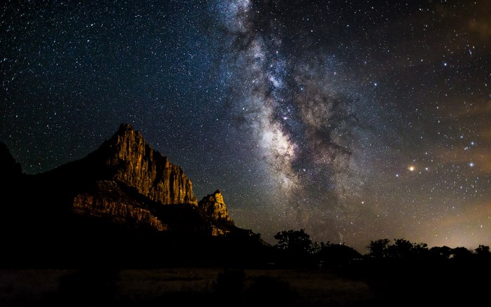 Milky Way over rocky mountains at night