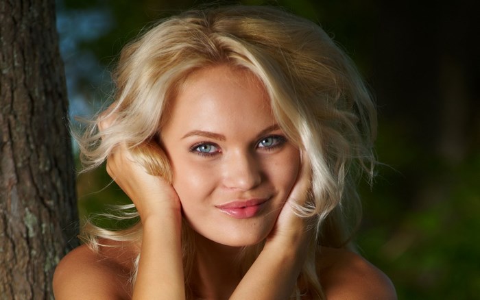 Portrait of Blonde Woman with Blue Eyes