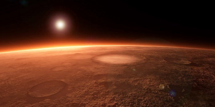 Mars landscape with craters and sun
