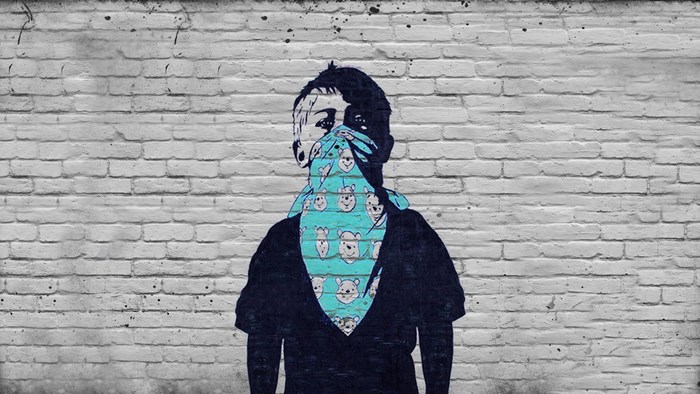 Graffiti of Boy with Blue Bandana on Brick Wall