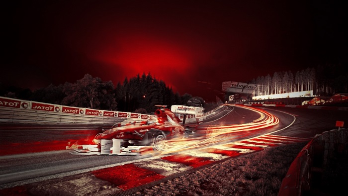 Formula 1 Race Car on Track at Night