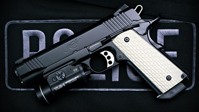Kimber 1911 pistol with Streamlight TLR-1