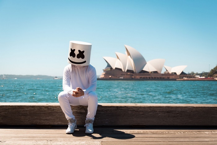 Marshmello sits in front of Sydney Opera House