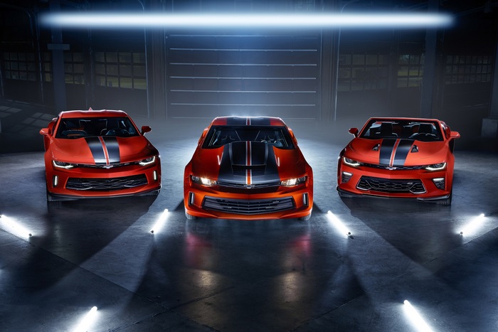 Three Chevrolet Camaros in a Garage