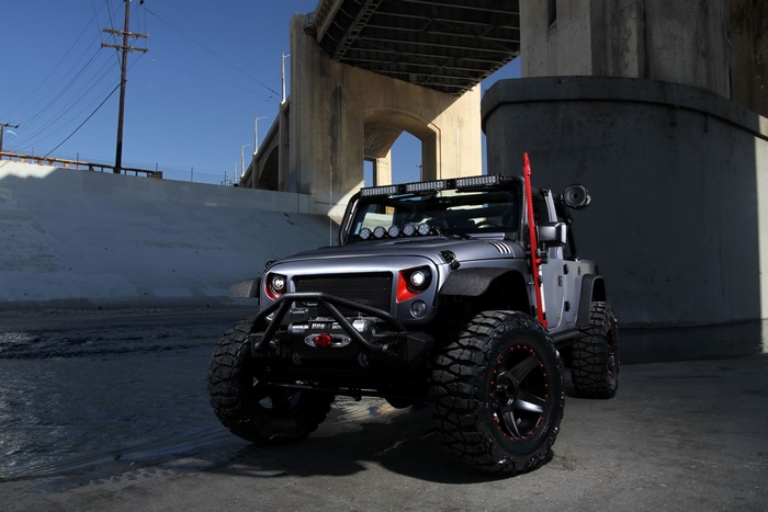 Modified Jeep Wrangler under a bridge
