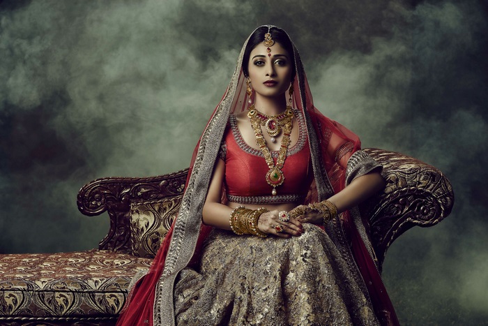 Woman in traditional Indian wedding attire and jewelry