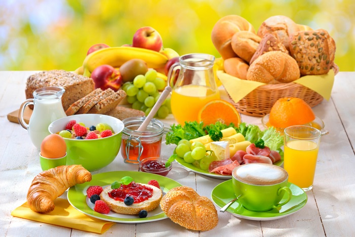 4K Breakfast Spread with Fruits, Breads, and Coffee