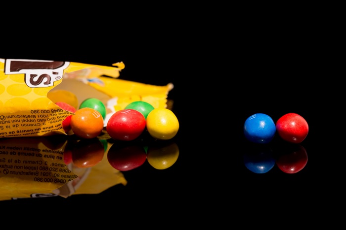 M&M's candies spilling from a bag