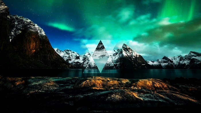Aurora Borealis over Snowy Mountains and Lake