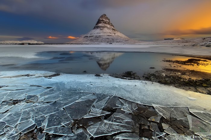 Kirkjufell mountain reflection in Iceland during sunset