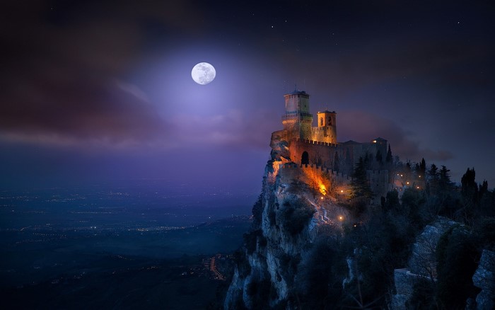 Castle on a cliff under the moon