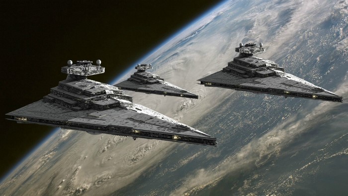 Three Star Destroyers in orbit above a planet