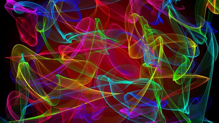 Abstract colorful glowing light trails on black background