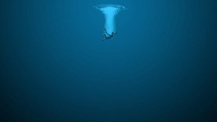 Person falling into deep blue water