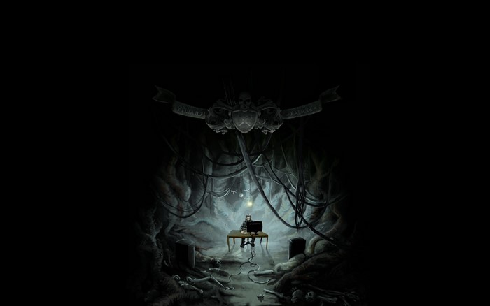 Person at computer in dark cave with skulls