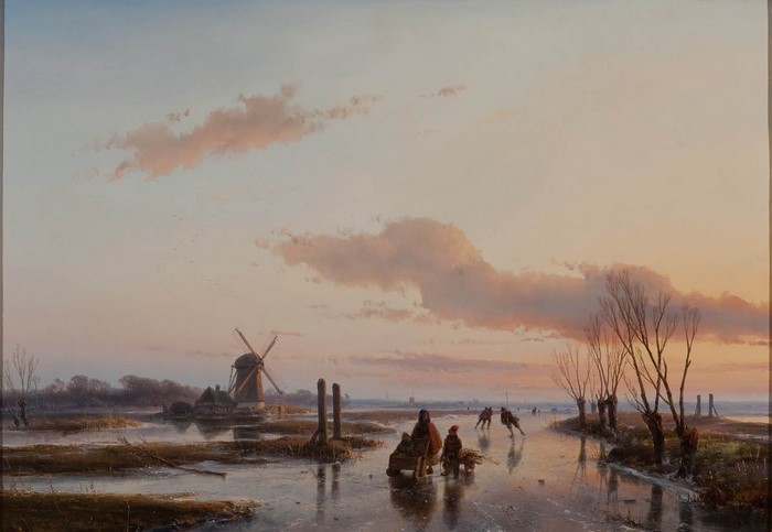 Winter scene with skaters and windmill at sunset