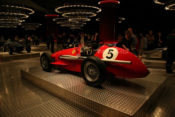 Red Ferrari Formula 1 car with number 5