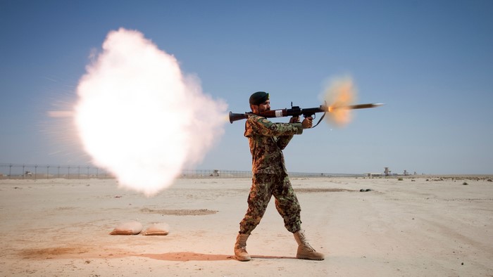 Afghan National Army soldier fires RPG-7 in desert