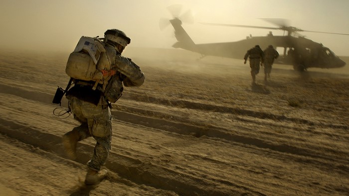 United States Army Soldier Approaching Military Helicopter