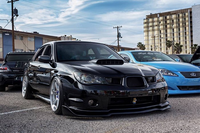 Black Subaru Impreza WRX STI parked on street