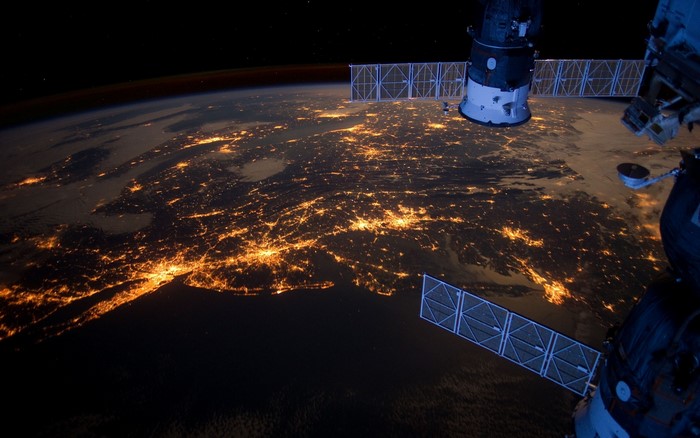 Earth at Night Viewed from Space with Satellite
