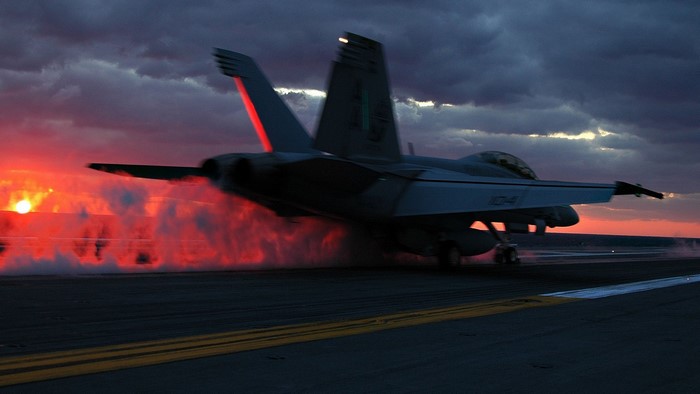McDonnell Douglas F/A-18 Hornet Taking Off at Sunset
