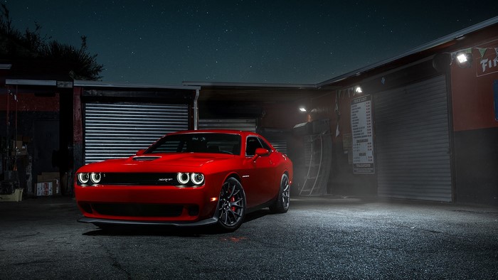 Red Dodge Challenger SRT Hellcat parked at night