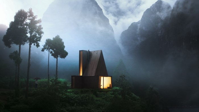 Modern cabin in misty mountains with trees